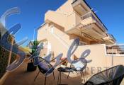 Se vende apartamento en planta alta con solárium y patio en Vista Azul XXVII en Punta Prima, Costa Blanca, España. ID1452