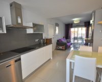 Apartments with private garden in a closed urbanization by the sea in Punta Prima, Orihuela Costa, Costa Blanca, Spain