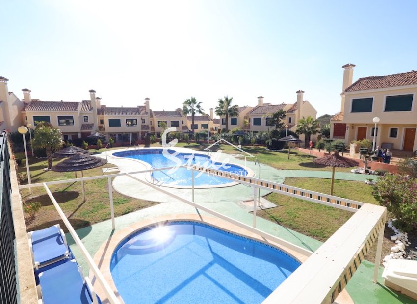 Купить семейный таунхаус с видом на море недалеко от пляжа в Campoamor Golf. ID 6311
