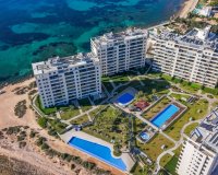 Se vende apartamento en primera línea con jardín privado en Posidonia, Punta Prima, Costa Blanca. ID2354