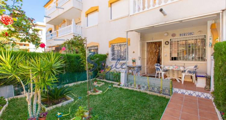 Apartment with large private garden and parking space just 200m from the beach of Punta Prima, Orihuela Costa, Costa Blanca, Spain