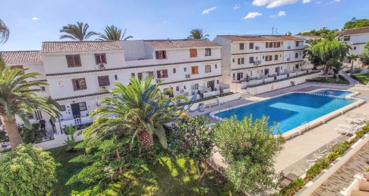 Townhouse for sale with communal swimming pool in Punta Prima, Rocajuna, close to the beach, Orihuela Costa, Costa Blanca, Spain