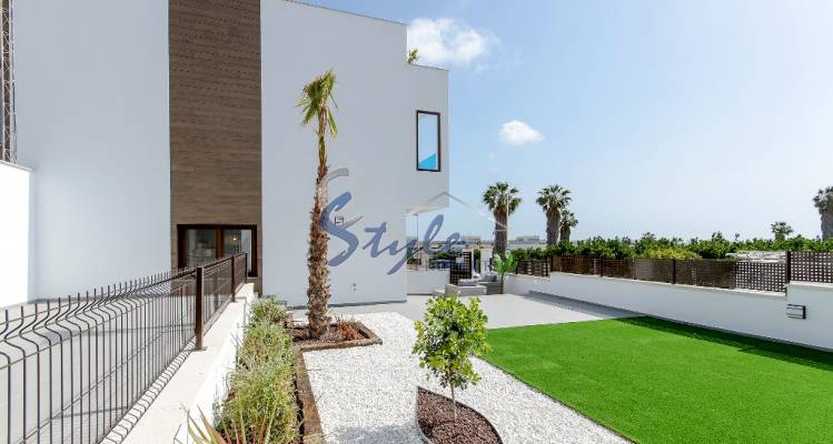 Modern townhouses by the sea in the urbanization of Los Balcones, Orihuela Costa, Costa Blanca, Spain. ON910