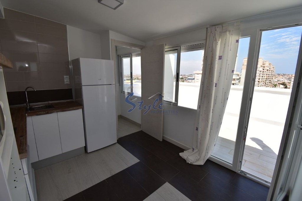 Buy penthouse apartment in Costa Blanca steps from the sea and beach in Torrevieja, Playa de los Locos. ID: 4851